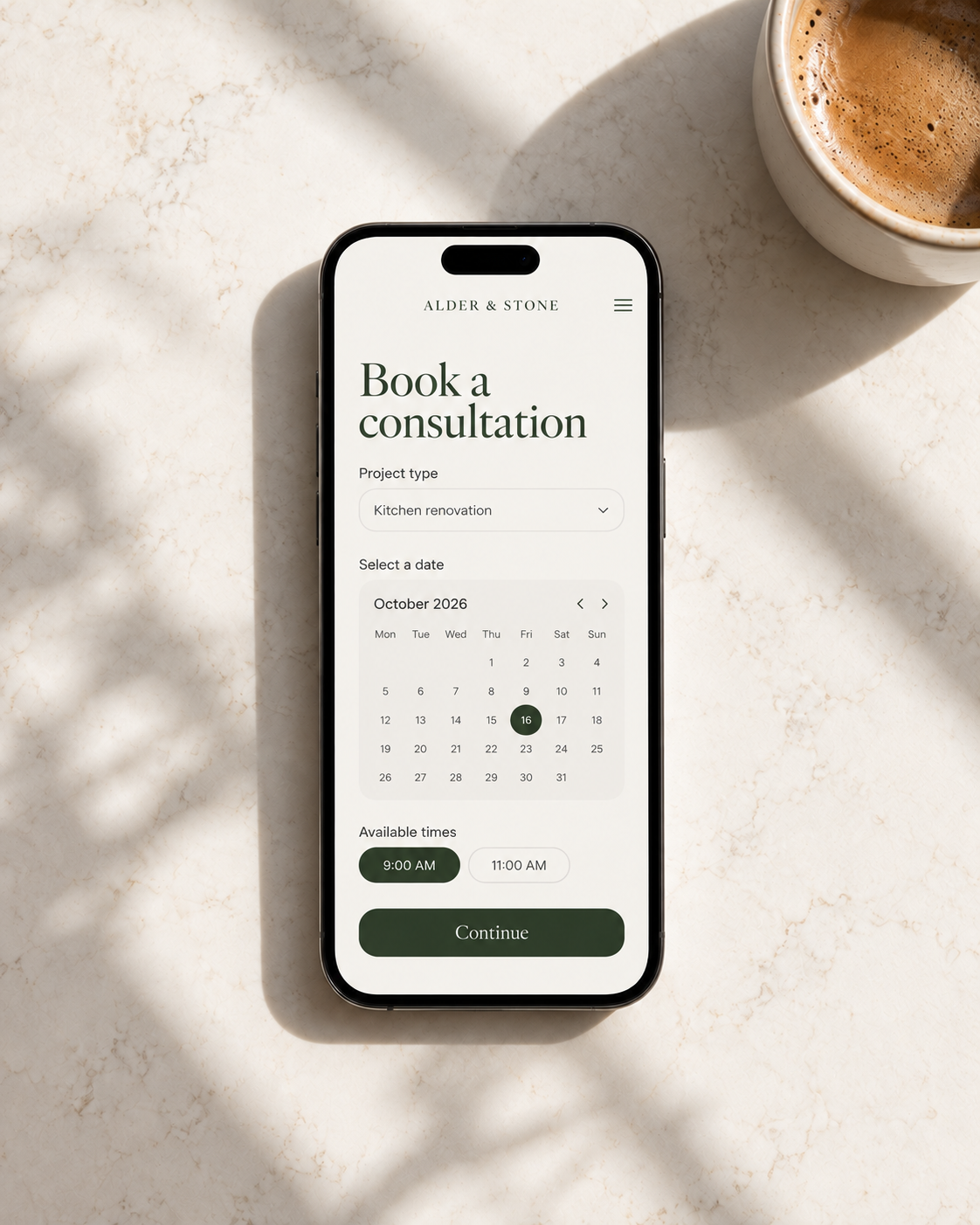 Phone on quartz countertop showing a renovation consultation booking calendar